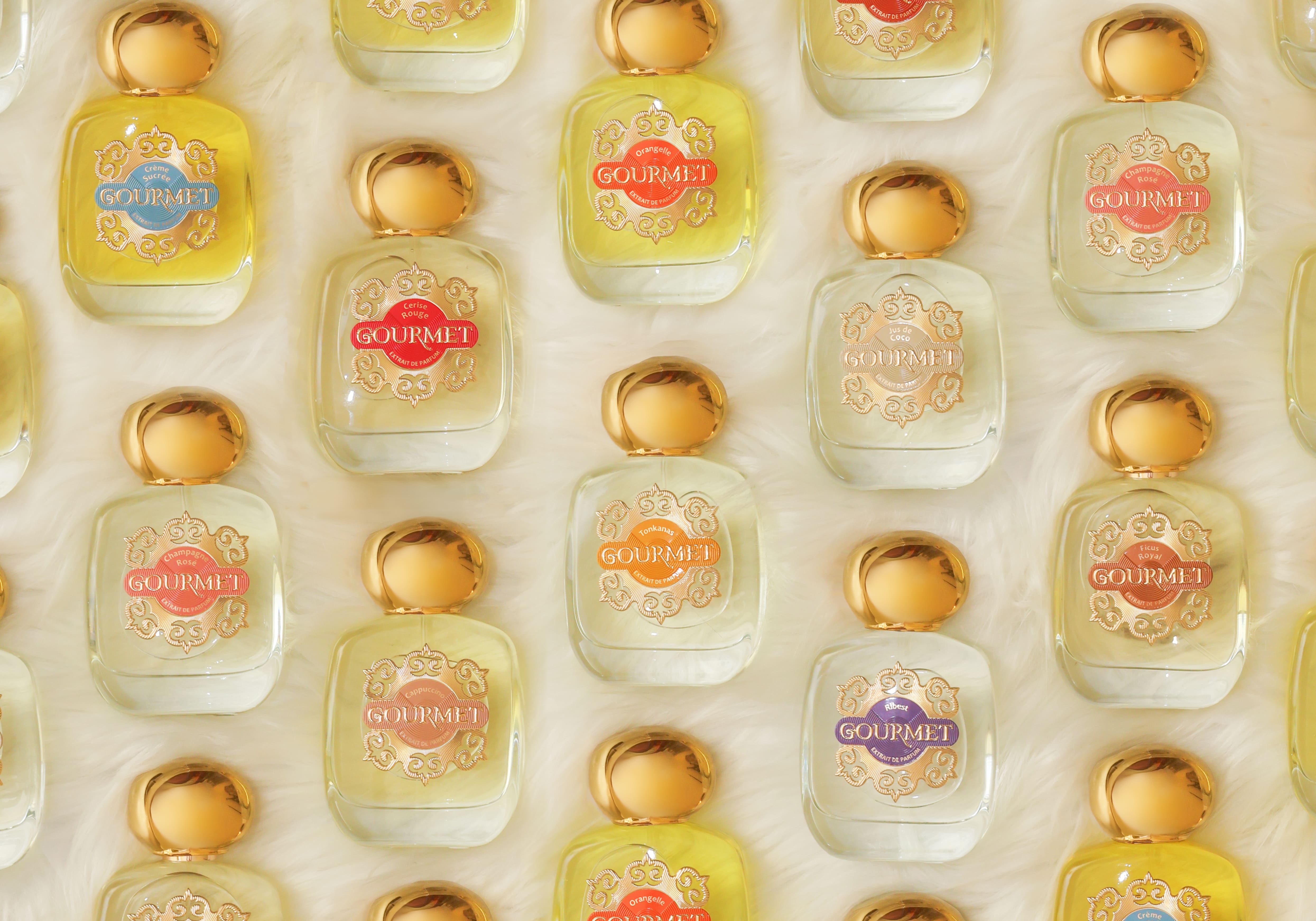 Immagine della collezione di profumi Gourmet, mostrando diverse bottiglie di fragranze