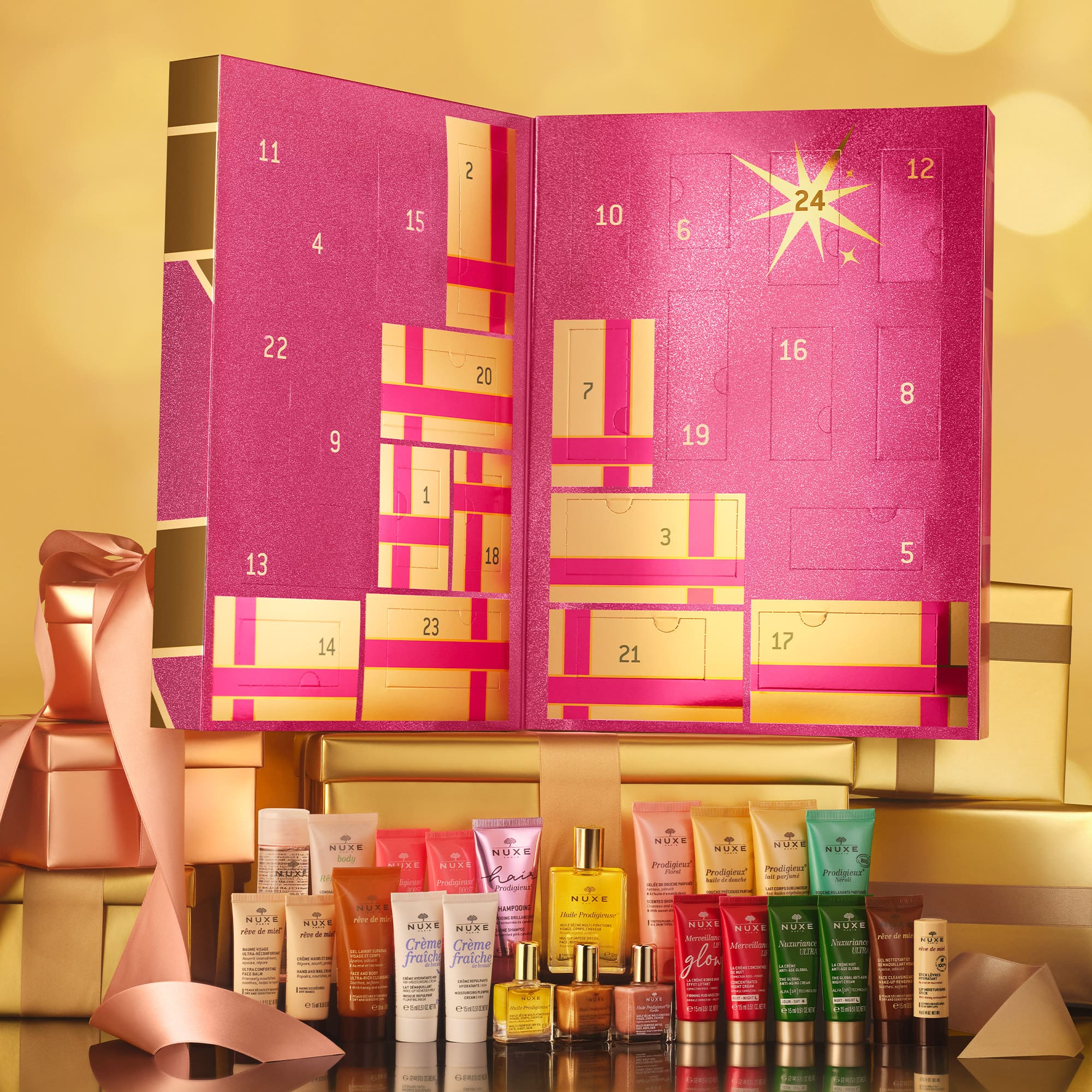 Calendario dell'Avvento NUXE 2024 con design rosa e nastri dorati