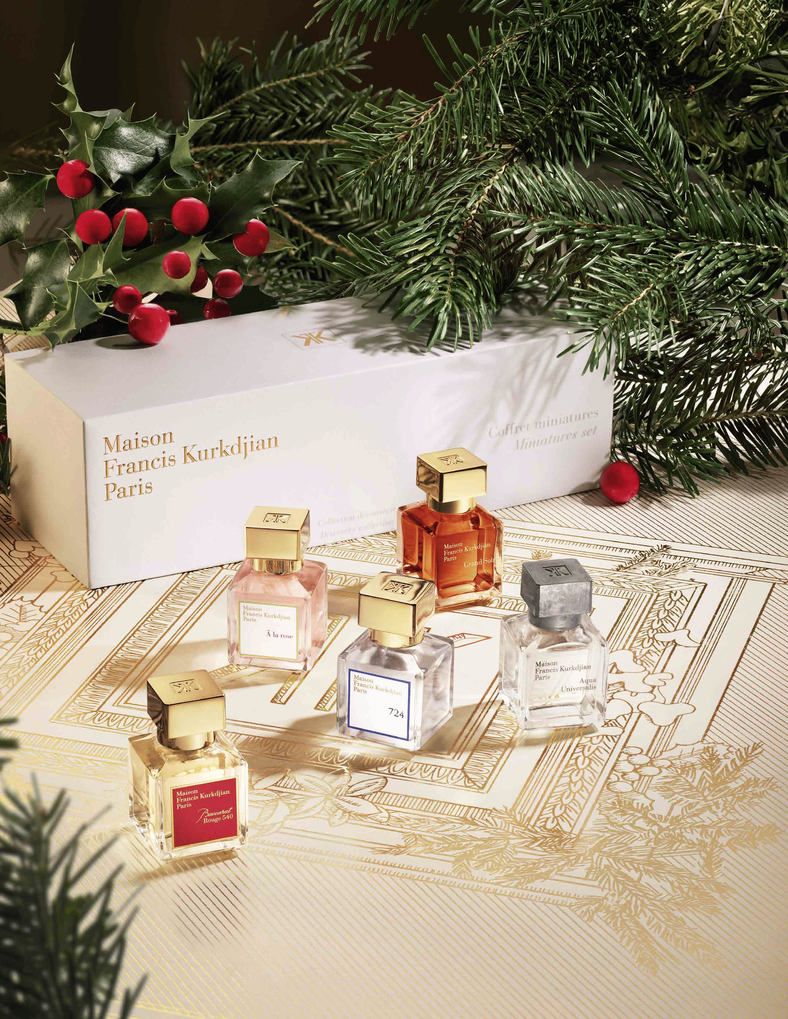 Collezione natalizia di profumi, candele e regali di Francis Kurkdjian per le festività 2024.