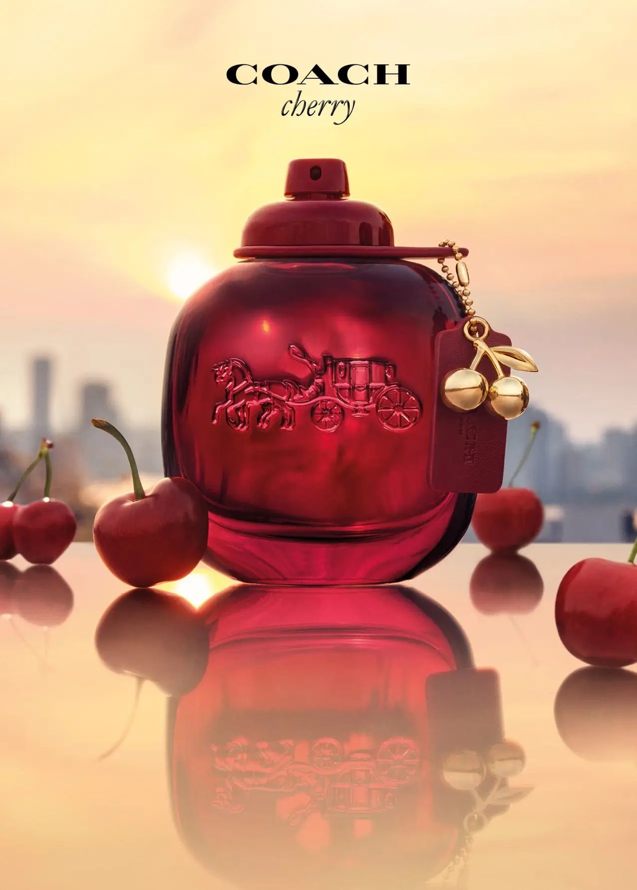 flacone profumo Coach Cherry rosso con charm ciliegia